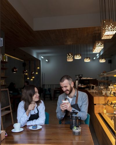 couple-wearing-aprons-coffee-shop
