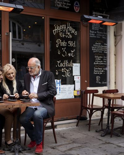full-shot-people-sitting-together-table